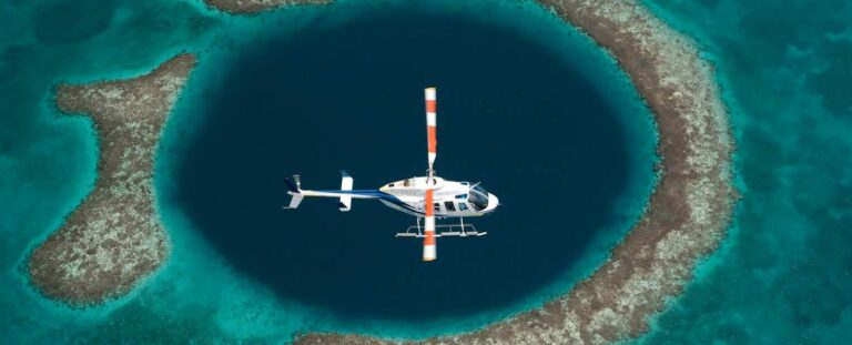 Helicopter flying above the Great Blue Hole in Belize